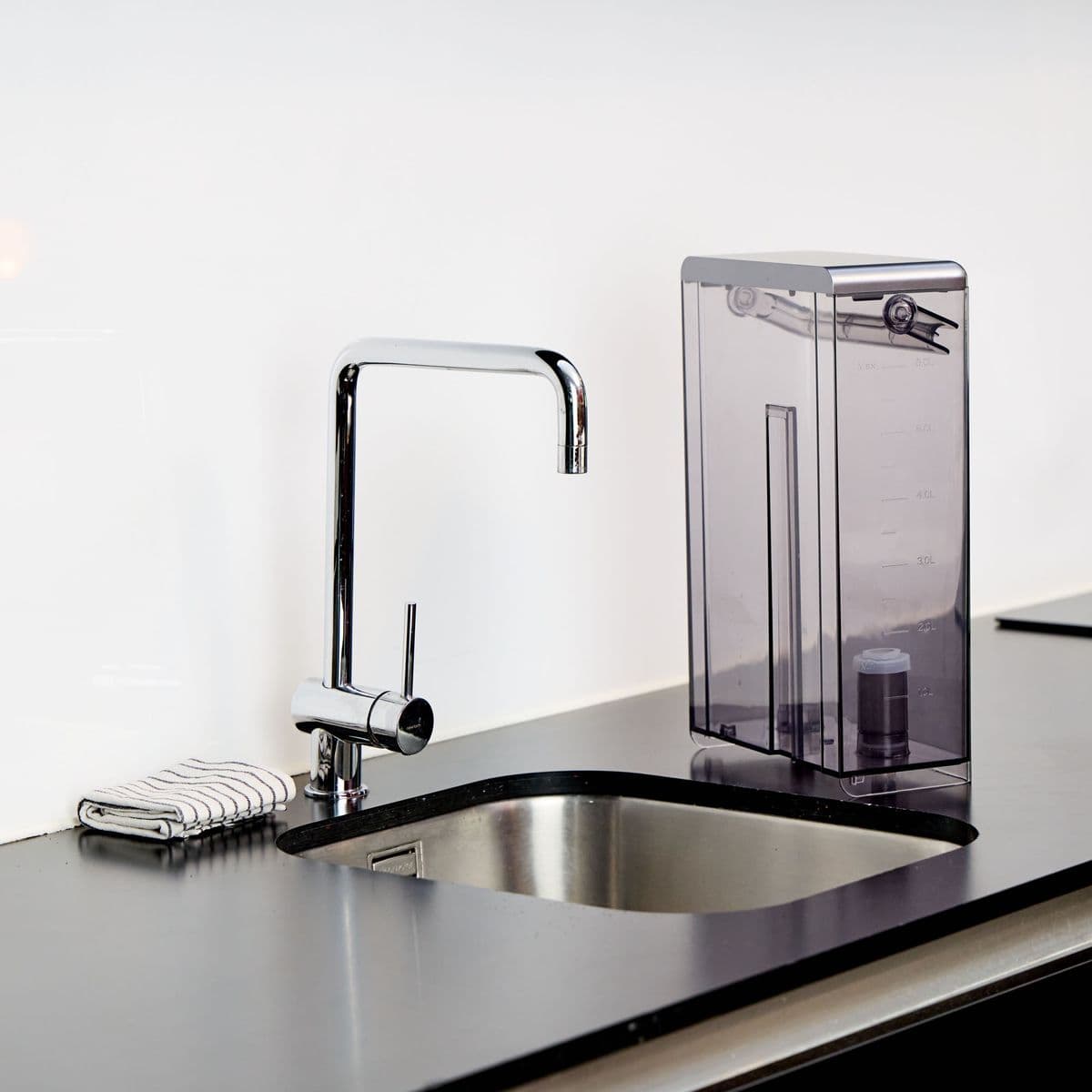 The Aqua water tank beside a kitchen sink